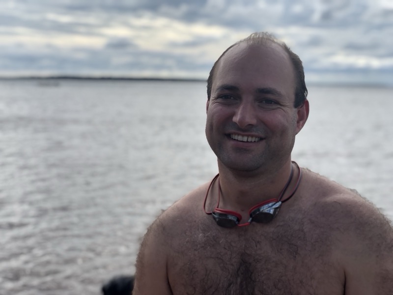 Smiling after a swim with goggles around the neck